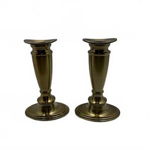 A pair of Valerie brand brass-toned candlesticks